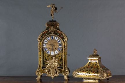 A significant violin-shaped sconce with a lamp bas
