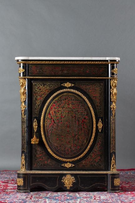 A counter-height cabinet made of blackened wood wi