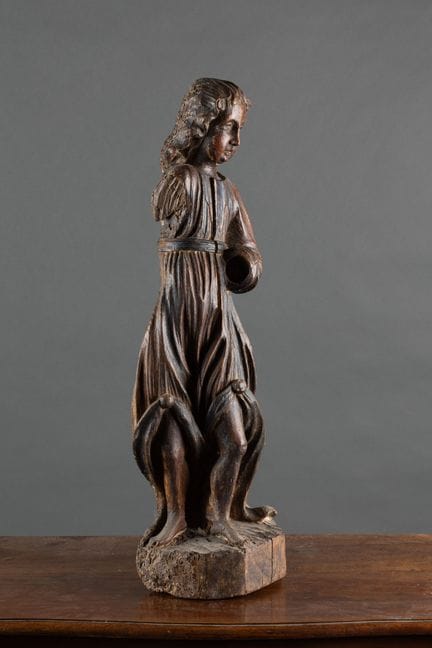 Polychrome wooden sculpture depicting a standing m