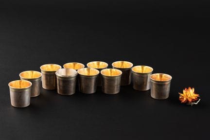 SERIE DE ONZE GOBELETS A LIQUEUR en argent (950). 