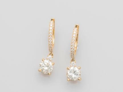 Pair of oval hoop earrings in 750°/°° (18K) yellow