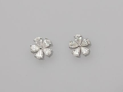 Pair of platinum flower earrings, each set with fi