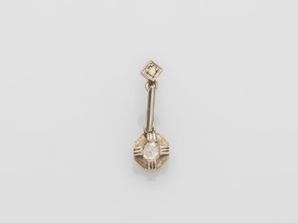 A solitary white gold dormeuse earring set with ro
