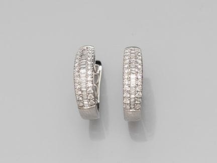 Pair of domed earrings in platinum, each set with 
