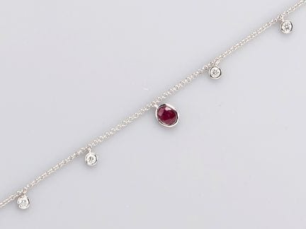 750°/°° (18K) white gold charm bracelet, adorned w