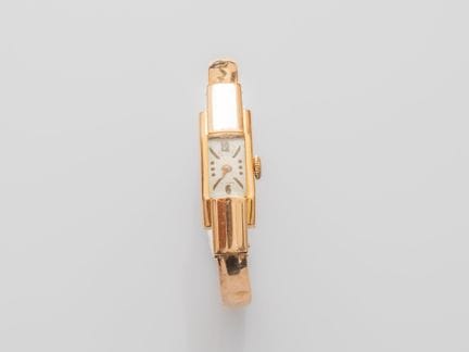 Women's yellow gold wristwatch with a domed rectan