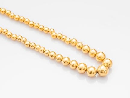 750°/°° (18K) yellow gold ball necklace, known as 