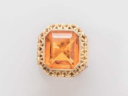 Rectangular, faceted signet ring set with a large 