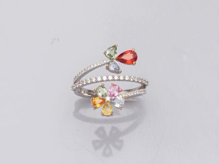 Platinum cross ring, decorated with flowers set wi