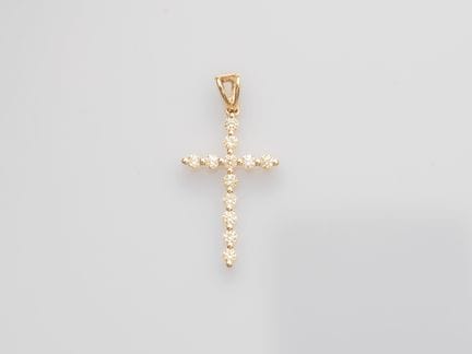 750°/°° (18K) yellow gold cross, set with brillian