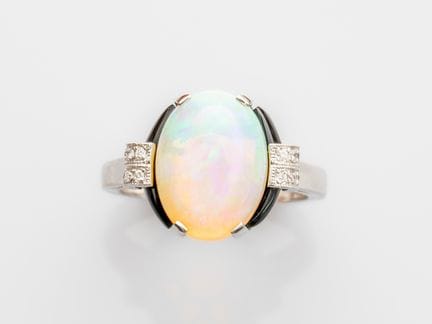 Platinum ring set with an oval cabochon opal weigh