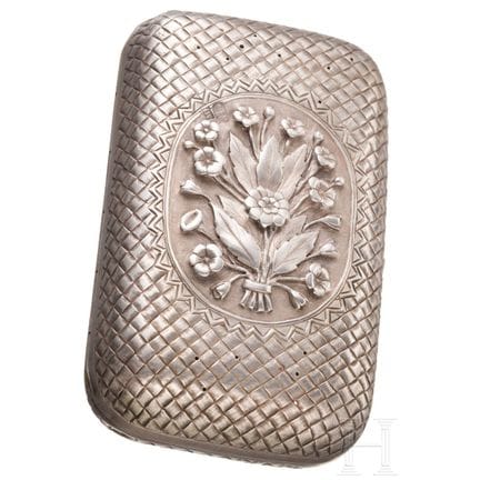 A silver trompe l'oeil cigarette case with flowers
