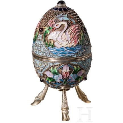A silver partial-gilt cloisonné enamel egg with sw