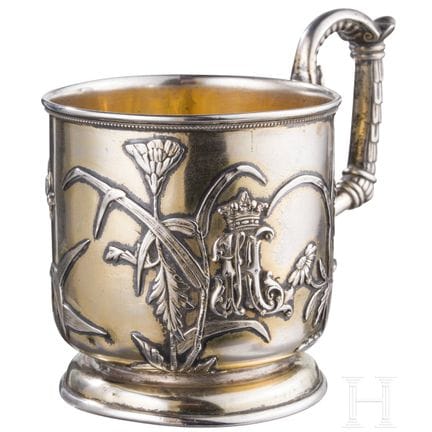 A silver-gilt tea glass holder with insect, Russia