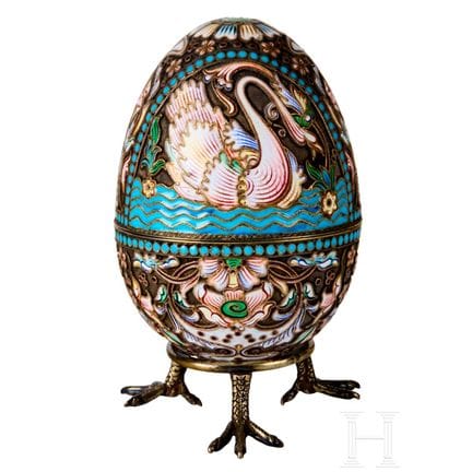 A silver and cloisonné enamel egg with swans, Russ