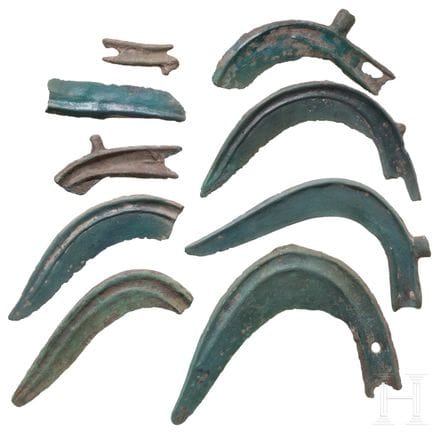 Three Bronze Age sickles and six sickle fragments,
