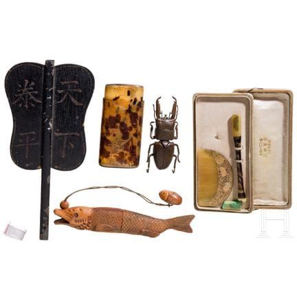 A collection of five objects (a fish-shaped inrō c
