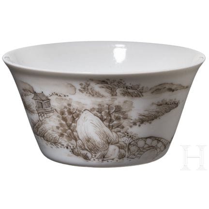A small grisaille cup depicting mountains and rive