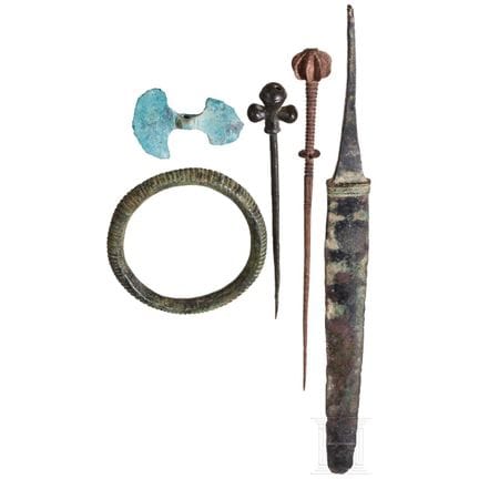 Five ancient bronze artifacts, dating from the lat