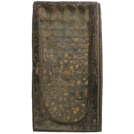 A large Thai bronze plaque depicting the footprint