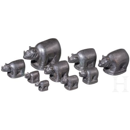 Nine rhino-shaped bronze opium weights, Burma, 20t