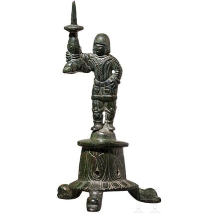An Early Byzantine brass torch in the shape of a s