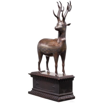 A gold- and silver-inlaid Koftgari iron figure of 