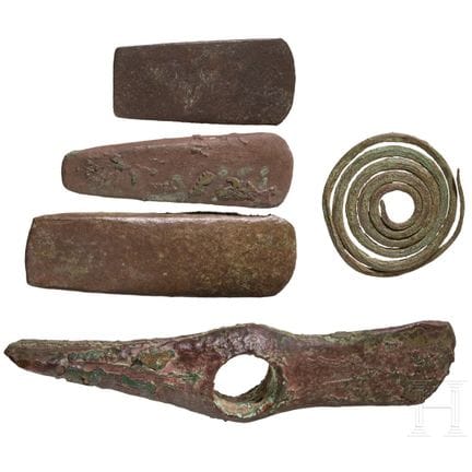 Five Copper Age artifacts: three flat axes, one ax