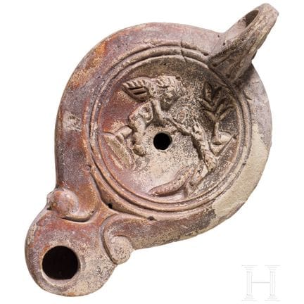 Lampe à huile en terre cuite décorée de motifs fig