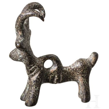 Pendentif de l'âge du fer ancien en forme de bouqu