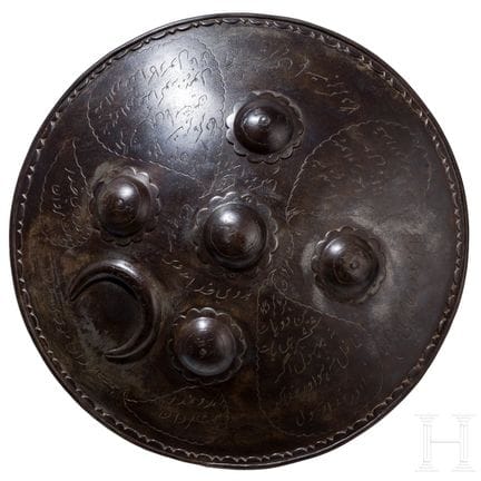 A Persian iron buckler (sipar), 19th century  
Mas