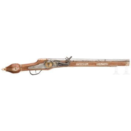 A wheellock pistol, collector's replica in the sty
