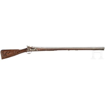 A fine flintlock shotgun with chiselled decoration