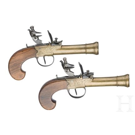 A pair of flintlock pocked pistols with brass blun