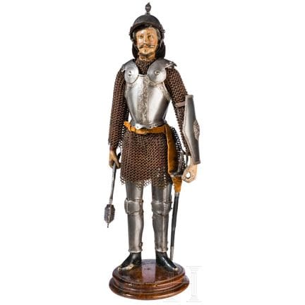 Una statuetta di un cavaliere napoletano con armat