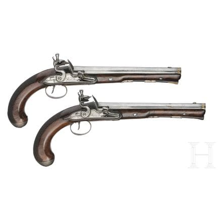 A pair of silver mounted flintlock pistols, Dupré 