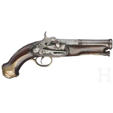 A Spanish converted miquelet percussion pistol  
O