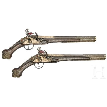 A fine pair of Ottoman silver-mounted flintlock pi