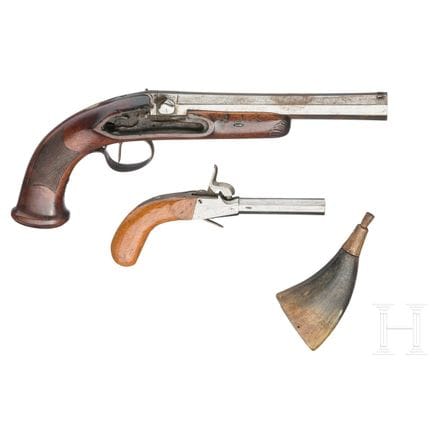 Two percussion pistols and a priming flask, first 