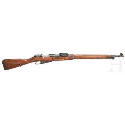 Un Tikka M27  
Calibre 7,62 mm Nagant, n.º 44976, 