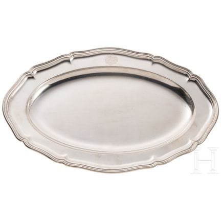 A silver serving platter from the tableware set of