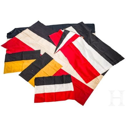 A collection of patriotic flags and a pennant, fir