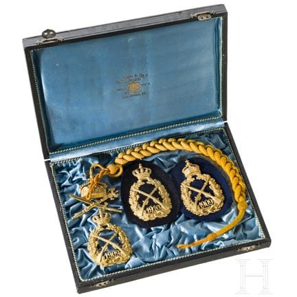 Un cordón imperial de tiro y tres insignias imperi