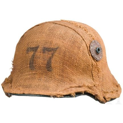 A camouflage cover for the M 1916 steel helmet  
G