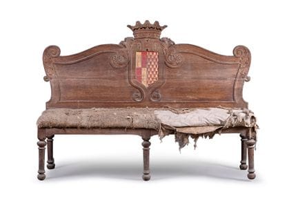 Carved and molded wooden bench with a curvilinear 