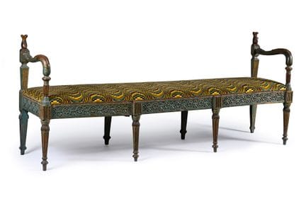 A pair of benches made of carved, molded wood, pai