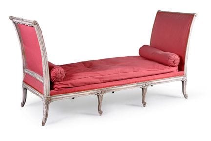 A carved, molded, and gray-lacquered wooden daybed