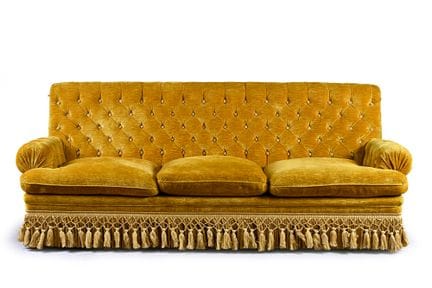 Comfortable yellow velvet sofa. The straight, tuft
