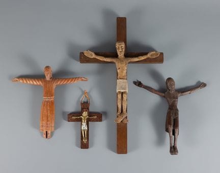 Set of four crucified Christs. 20th century.

Wood
