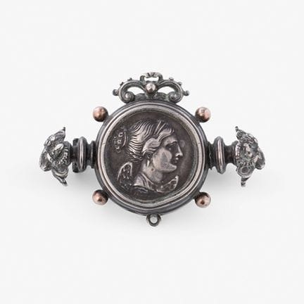 Historicist brooch with a Greco-Roman-inspired coi